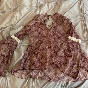 Burgundy peplum style top with bell sleeves